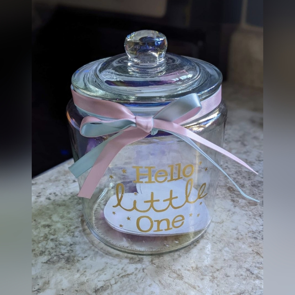 Glass jar that says "hello little one "made by Kate Aspen